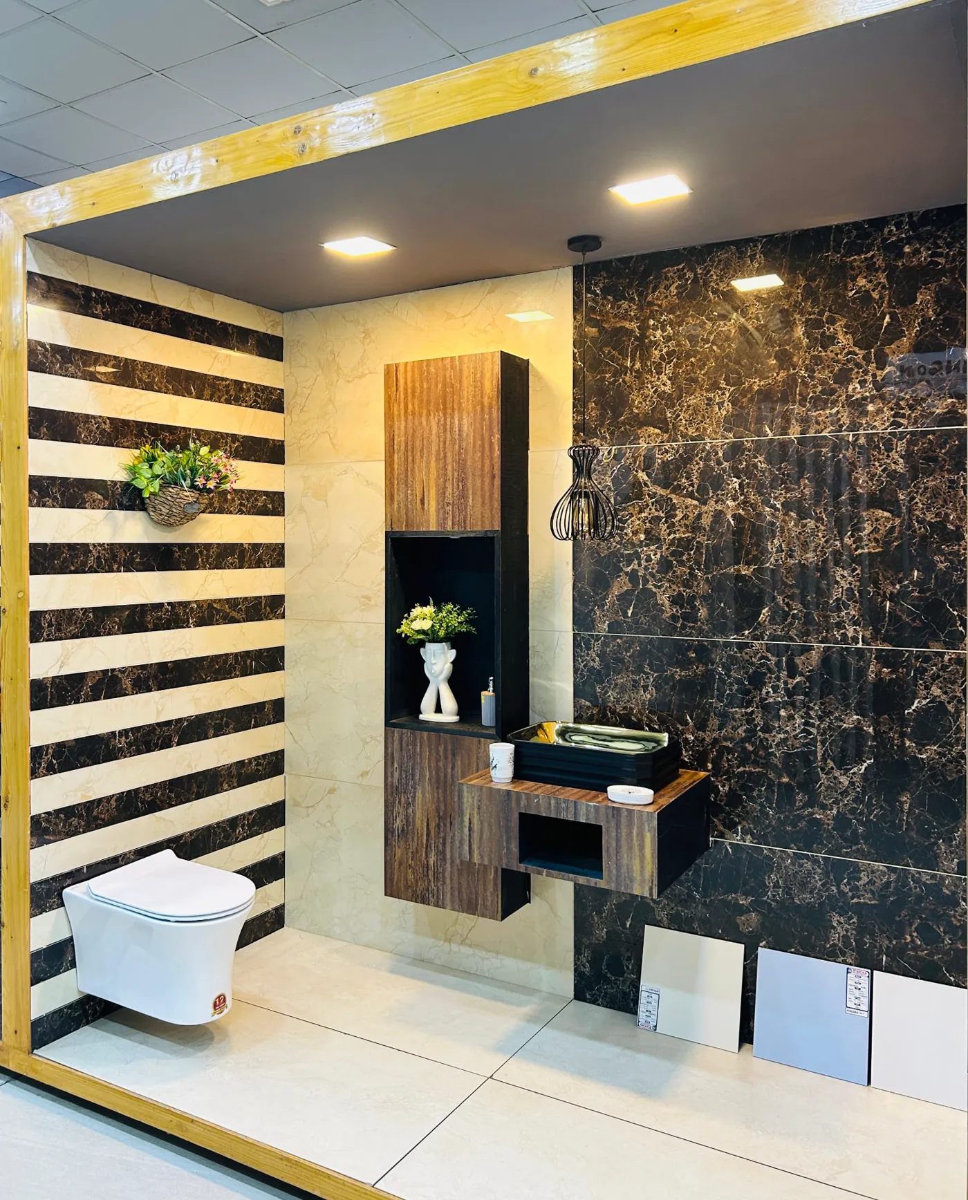 Black and cream striped tile bathroom bay with wall-hung WC and wooden vanity