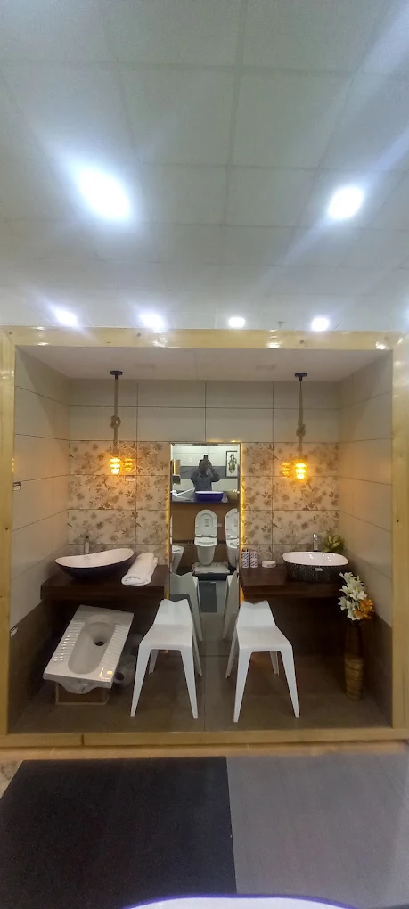 Bathroom mock-up bay with floral wall tiles, basin and water closet
