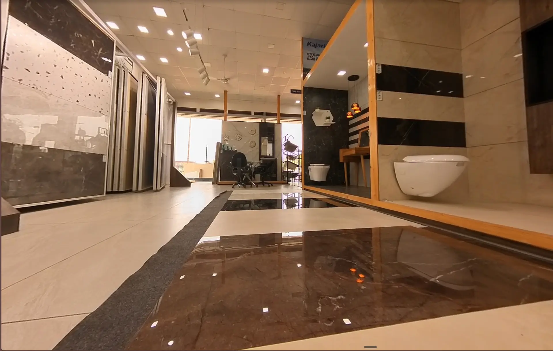 Granite and large-format slabs racked along the showroom aisle