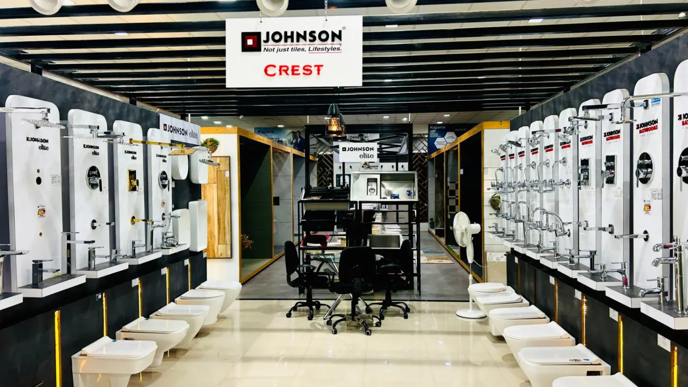 Johnson Crest CP fittings display wall with faucets, mixers and showers